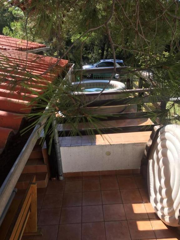 a house with a car parked in a parking lot at House Tia in Baška Voda