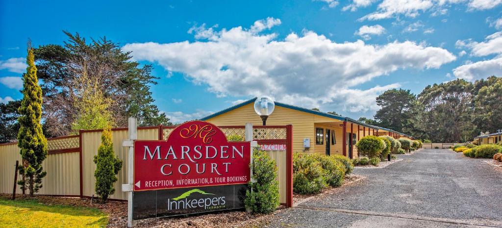 a sign in front of a maracist court building at Marsden Court Apartments Now incorporating Marsden Court and Sharonlee Strahan Villas in Strahan
