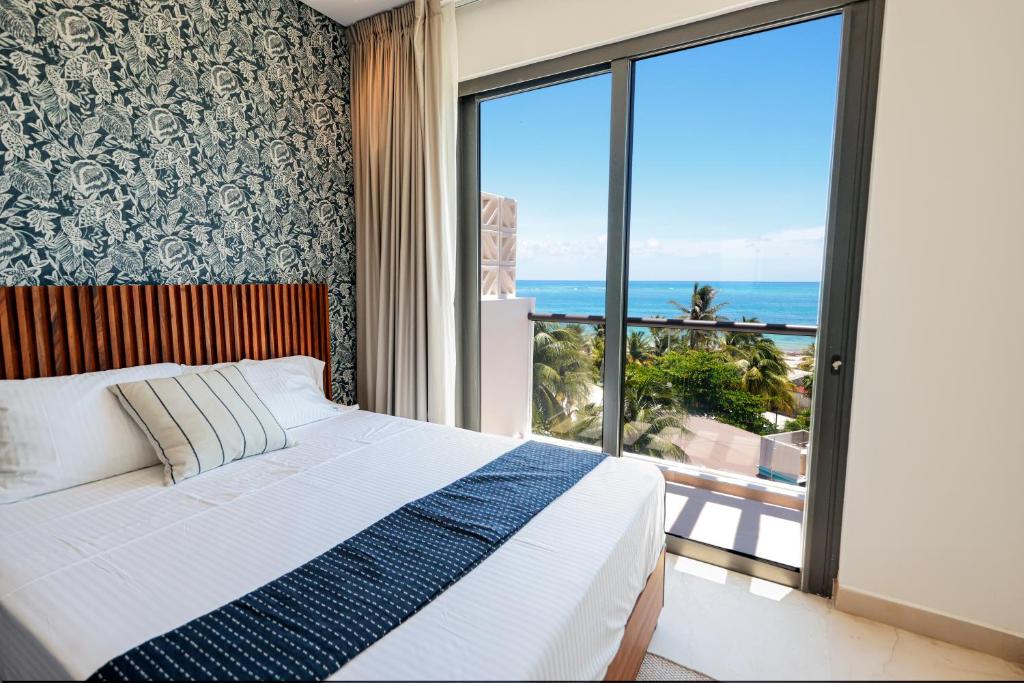 Ένα ή περισσότερα κρεβάτια σε δωμάτιο στο Porto Blu