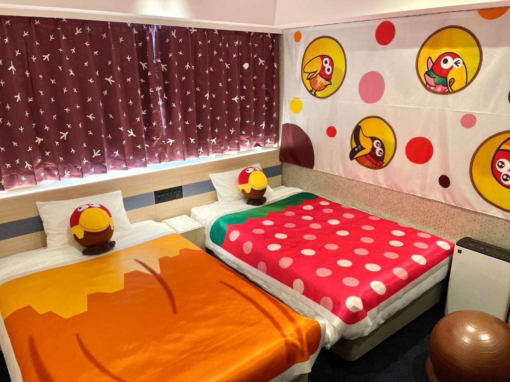 Postel nebo postele na pokoji v ubytování Henn na Hotel Premier Kagoshima Tenmonkan