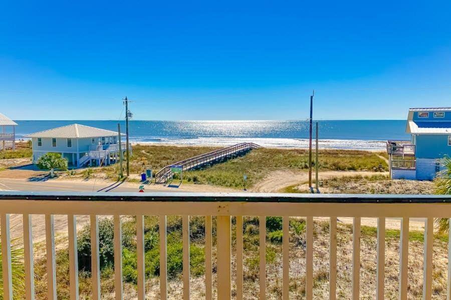 a view of the beach from the balcony of a beach house at Dream Chaser-Private Pool-Pet Friendly-Directly across from boardwalk to beach in St. George Island