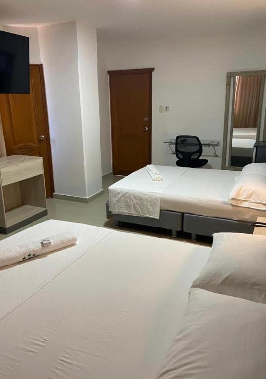 Postel nebo postele na pokoji v ubytování Hotel Vans Valledupar