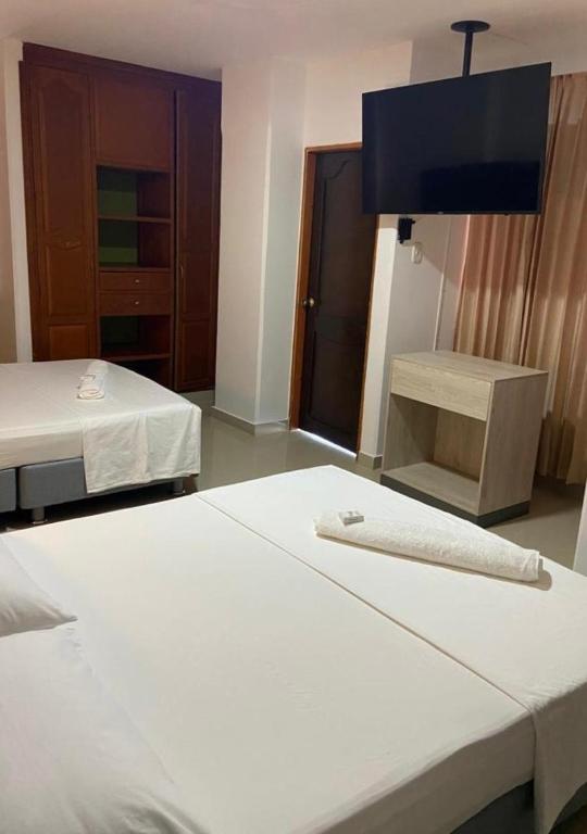 Postel nebo postele na pokoji v ubytování Hotel Vans Valledupar