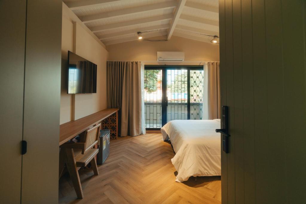 Postel nebo postele na pokoji v ubytování Hotel Boutique Roomzz Laureles