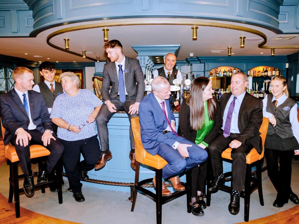 a group of people sitting in chairs in a bar at Springfield Hotel in Leixlip