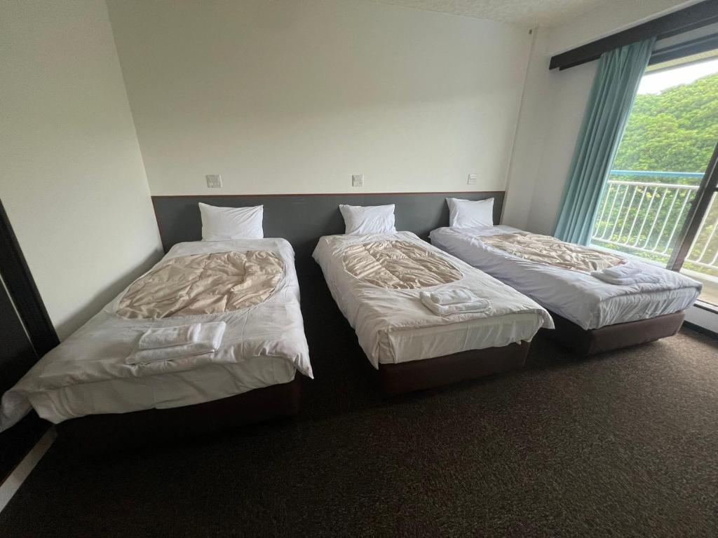 Postel nebo postele na pokoji v ubytování Guest House Bigfisher Club