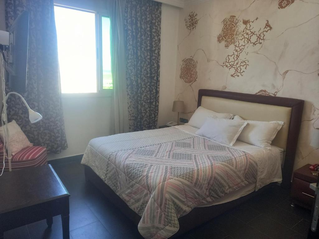 Postel nebo postele na pokoji v ubytování Hotel Salime Al Khozama