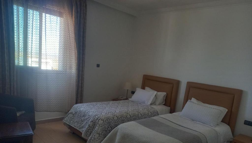Postel nebo postele na pokoji v ubytování Hotel Salime Al Khozama