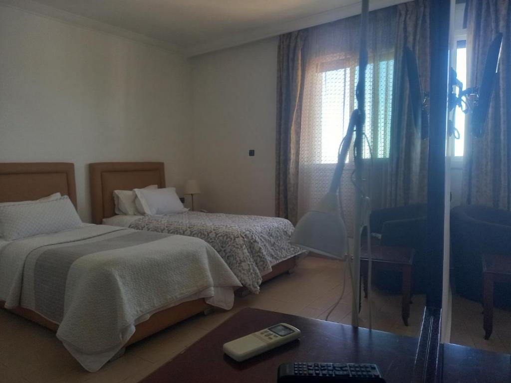 Postel nebo postele na pokoji v ubytování Hotel Salime Al Khozama