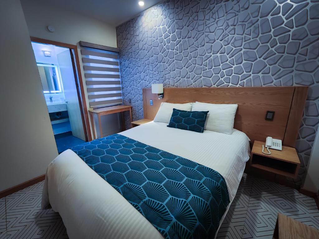 Postel nebo postele na pokoji v ubytování HOTEL AZUL AGAVE