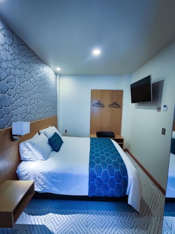 Postel nebo postele na pokoji v ubytování HOTEL AZUL AGAVE