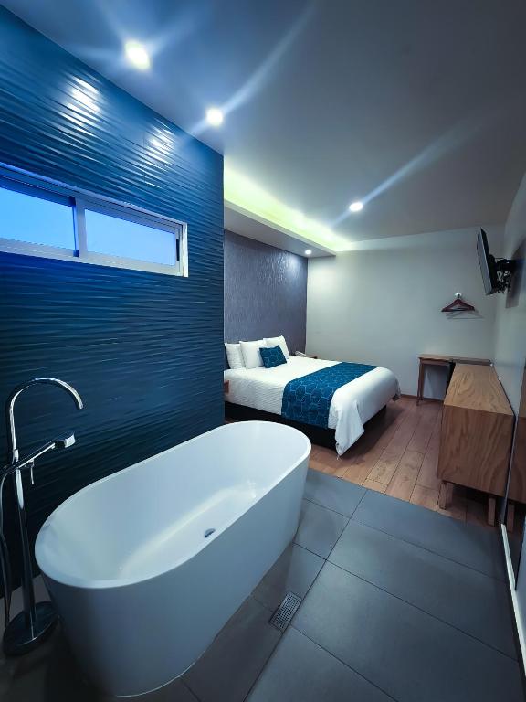 Postel nebo postele na pokoji v ubytování HOTEL AZUL AGAVE