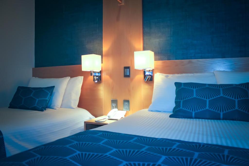 Postel nebo postele na pokoji v ubytování HOTEL AZUL AGAVE