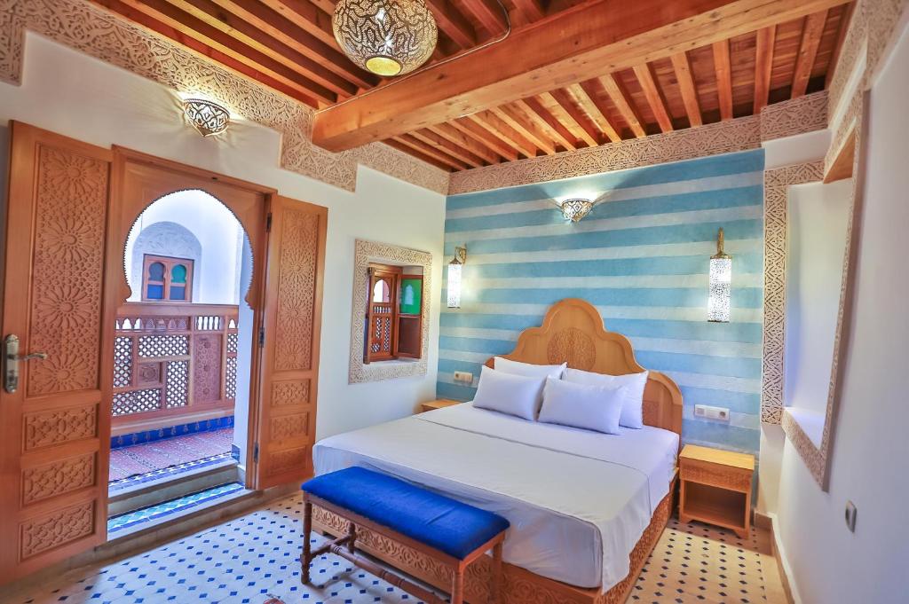 Postel nebo postele na pokoji v ubytování Riad Ridaya