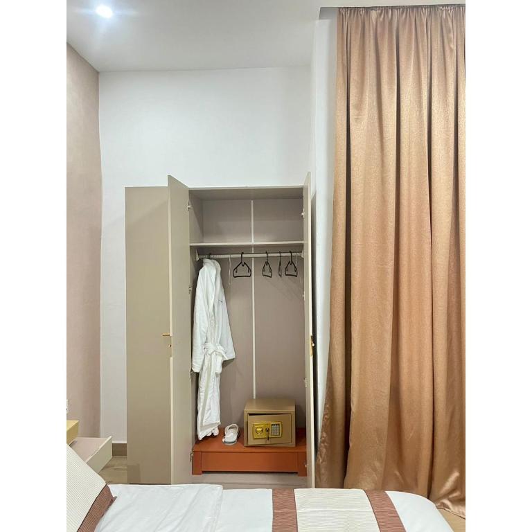 Postel nebo postele na pokoji v ubytování Milennium Hotel Nouadhibou
