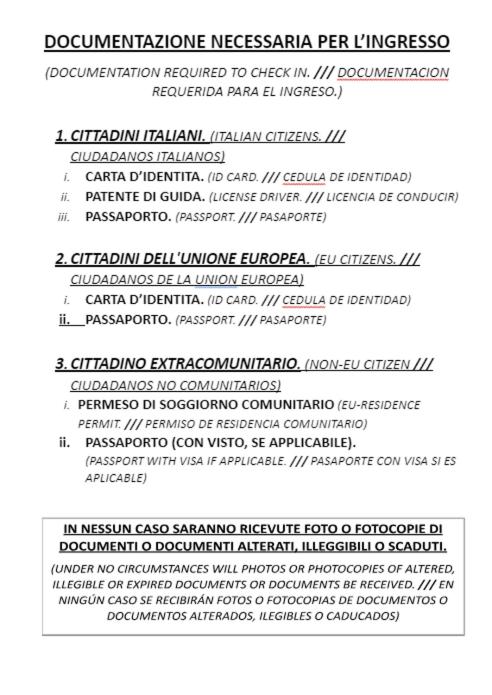 a stack ofritten documents with the names of different languages at Hostel Castello Maggiore in Rome
