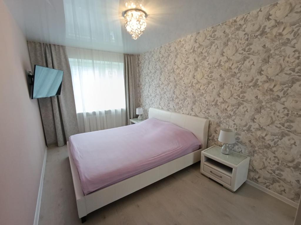 Postel nebo postele na pokoji v ubytování New Comfortable Apartment in center