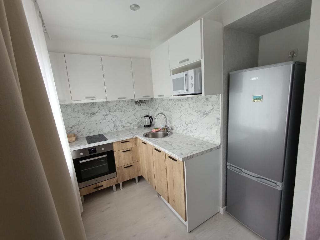 Kuchyň nebo kuchyňský kout v ubytování New Comfortable Apartment in center