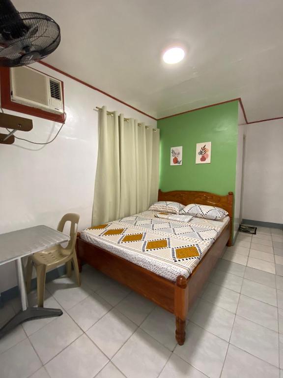 Postel nebo postele na pokoji v ubytování Em's Homestay