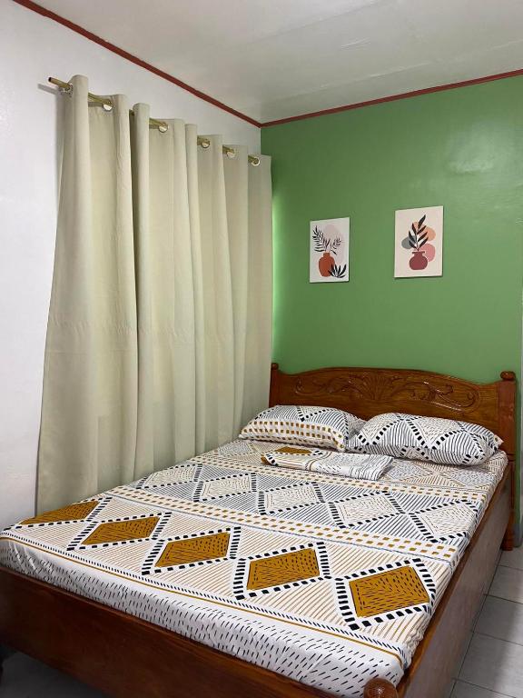 Postel nebo postele na pokoji v ubytování Em's Homestay