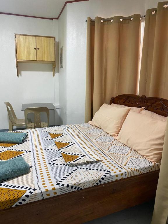Postel nebo postele na pokoji v ubytování Em's Homestay