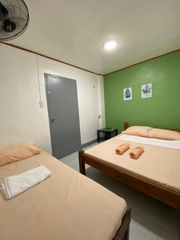 Postel nebo postele na pokoji v ubytování Em's Homestay
