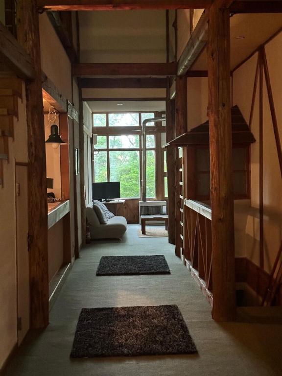 Postel nebo postele na pokoji v ubytování Yamadasan Ski Lodge - Madarao