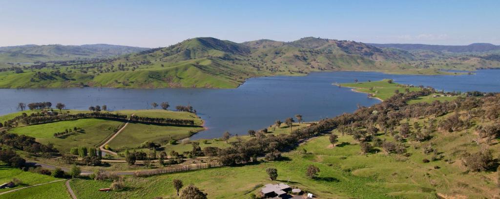 an aerial view of a lake on a hill at The Good House in Kiewa