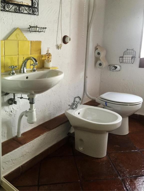 a bathroom with a sink and a toilet at La Carrihuela in Algodonales