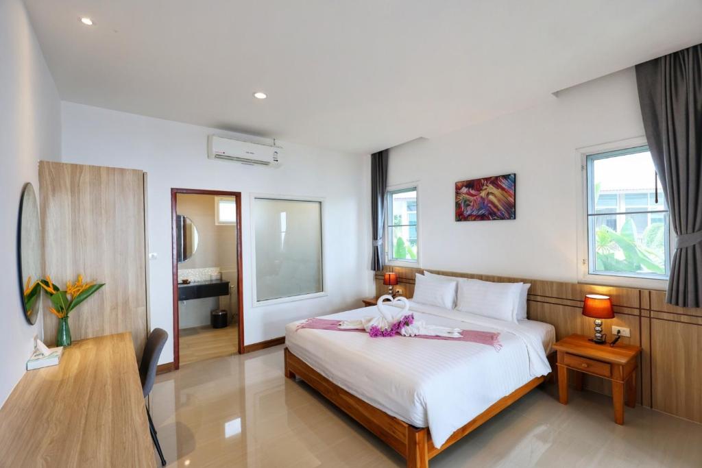 Postel nebo postele na pokoji v ubytování Horizon Beach Resort Koh Jum