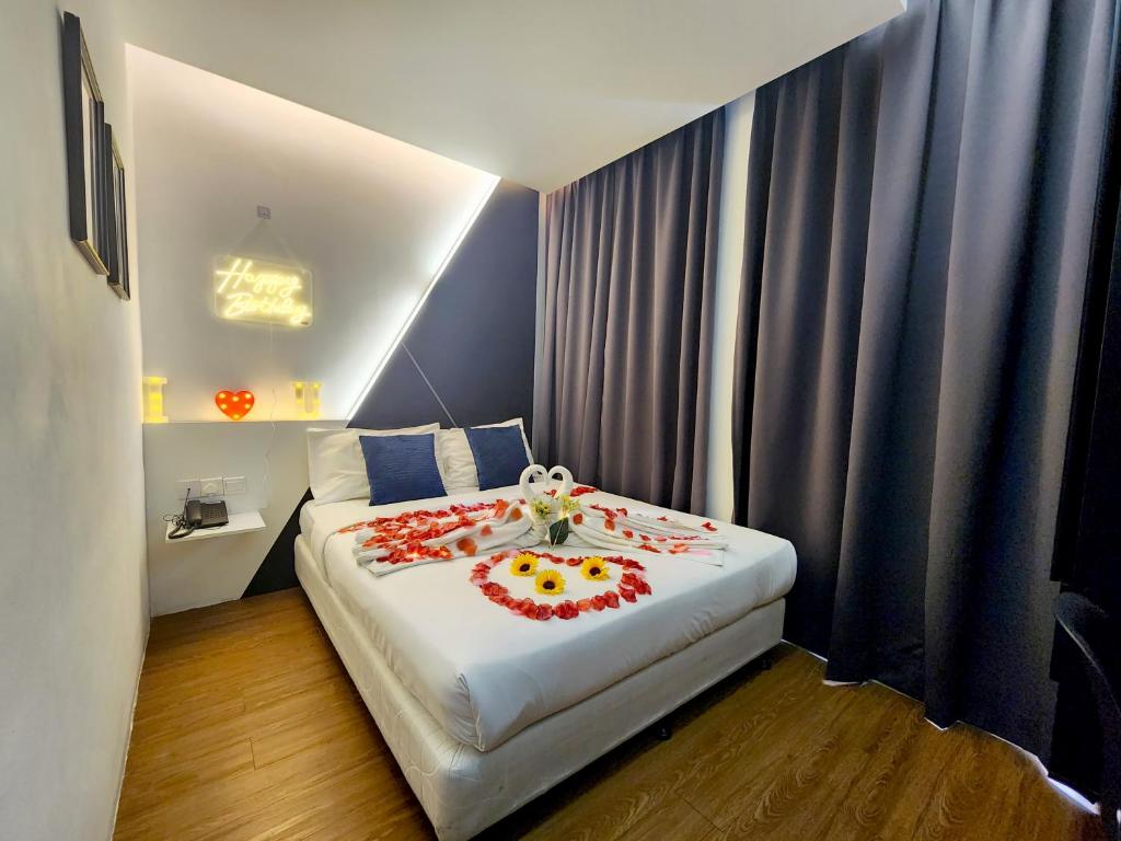 Postel nebo postele na pokoji v ubytování Rica Hotel Usj
