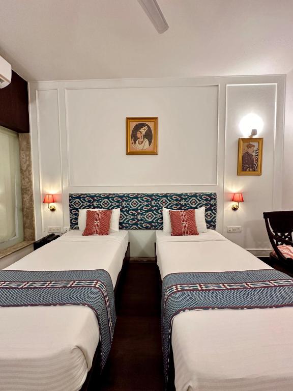 Postel nebo postele na pokoji v ubytování Hotel Atulyaa Taj