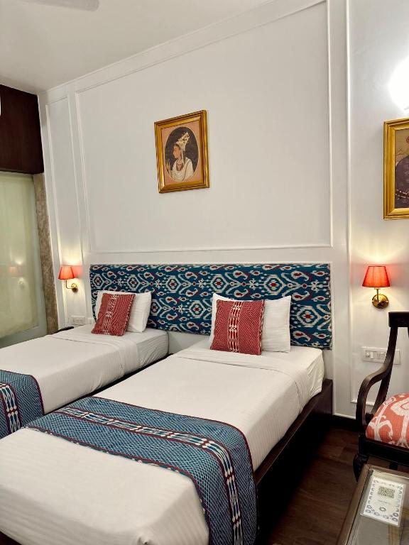 Postel nebo postele na pokoji v ubytování Hotel Atulyaa Taj