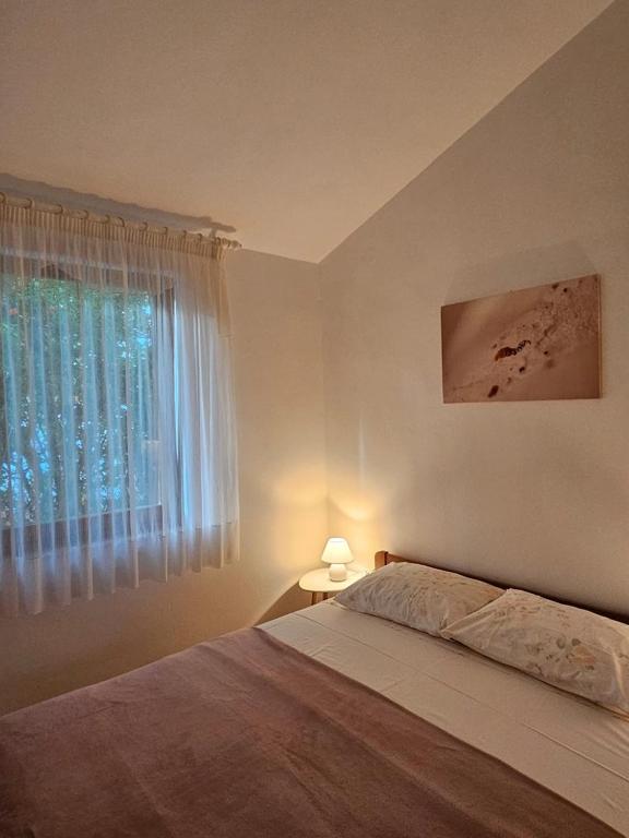 Postel nebo postele na pokoji v ubytování Lorena Apartments in Pula