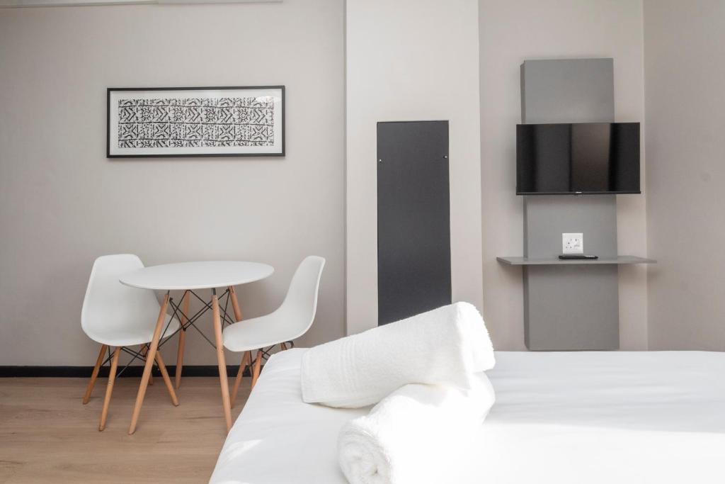 Postel nebo postele na pokoji v ubytování HAVN Aparthotel by Totalstay