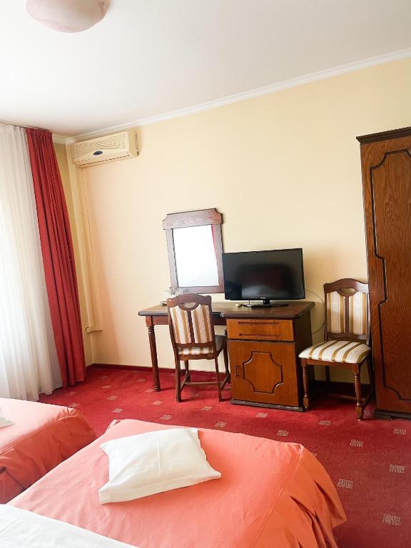 Postel nebo postele na pokoji v ubytování Hotel Premier