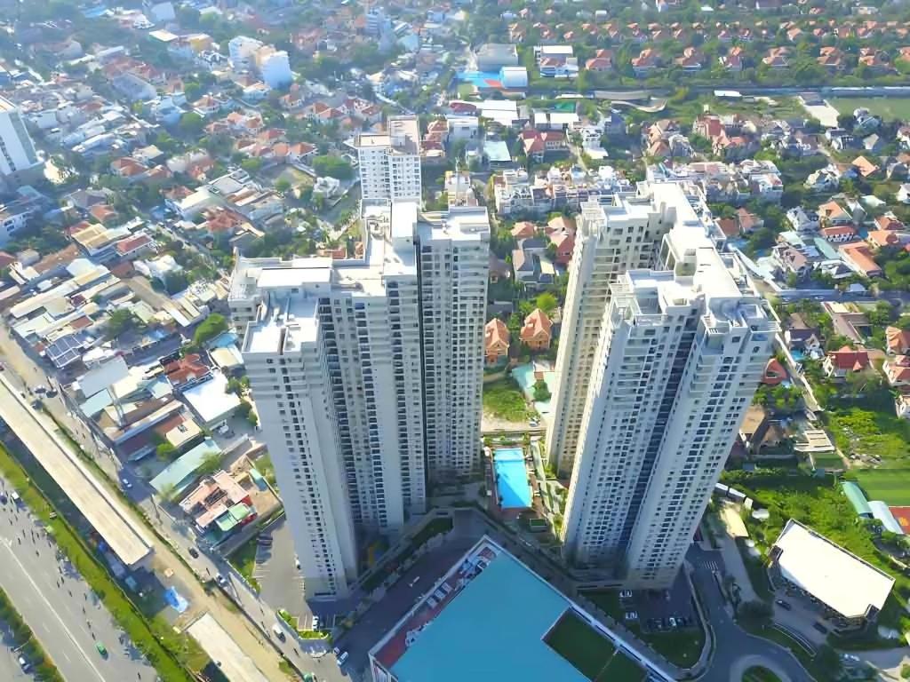 an aerial view of a city with tall buildings at Masteri Thao Dien Riverside Apartment in Ho Chi Minh City