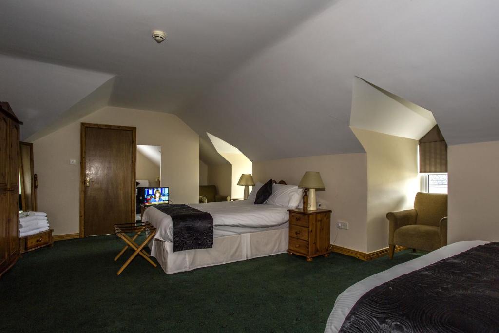 Postel nebo postele na pokoji v ubytování Percy French Hotel