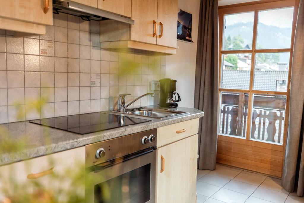 Kuchyň nebo kuchyňský kout v ubytování Apartment Obkircher