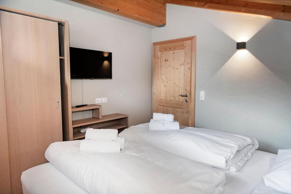 Postel nebo postele na pokoji v ubytování Residence Zillertal