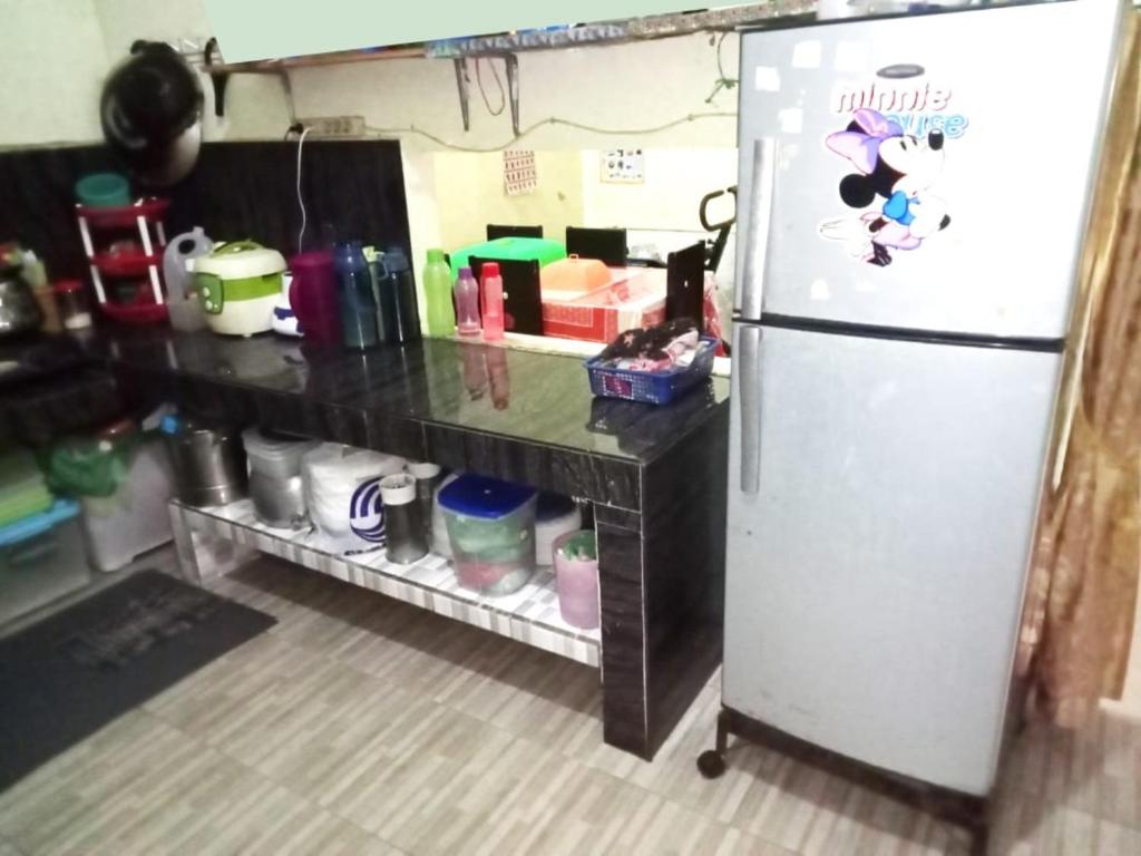 Kuchyň nebo kuchyňský kout v ubytování Benatsya Homestay
