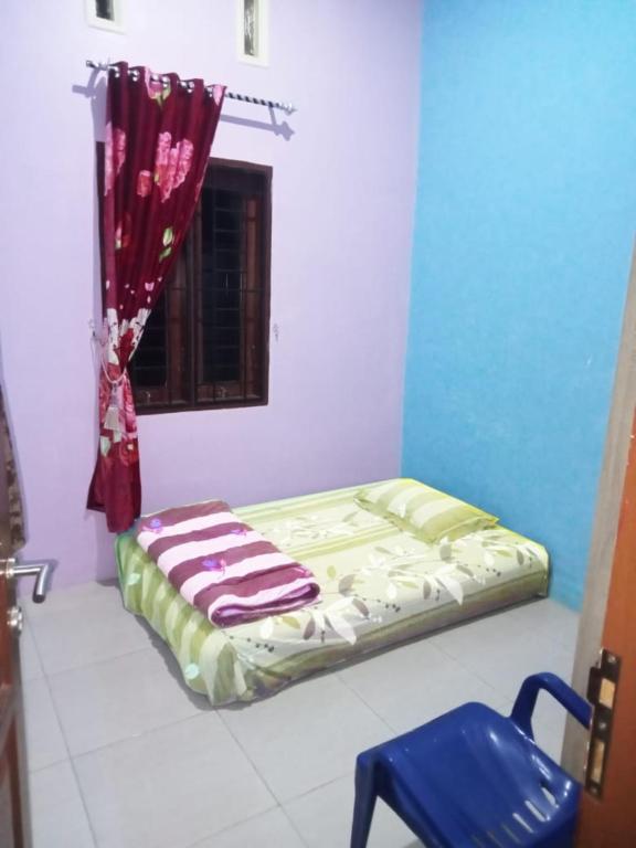 Postel nebo postele na pokoji v ubytování Benatsya Homestay