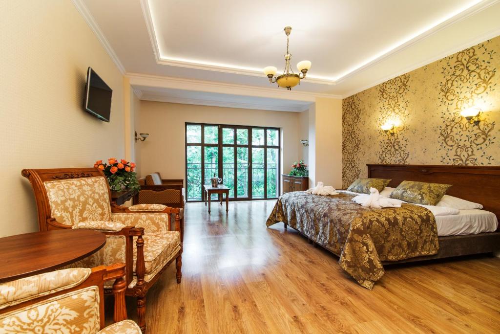 Postel nebo postele na pokoji v ubytování Pałac Margot Nature&SPA