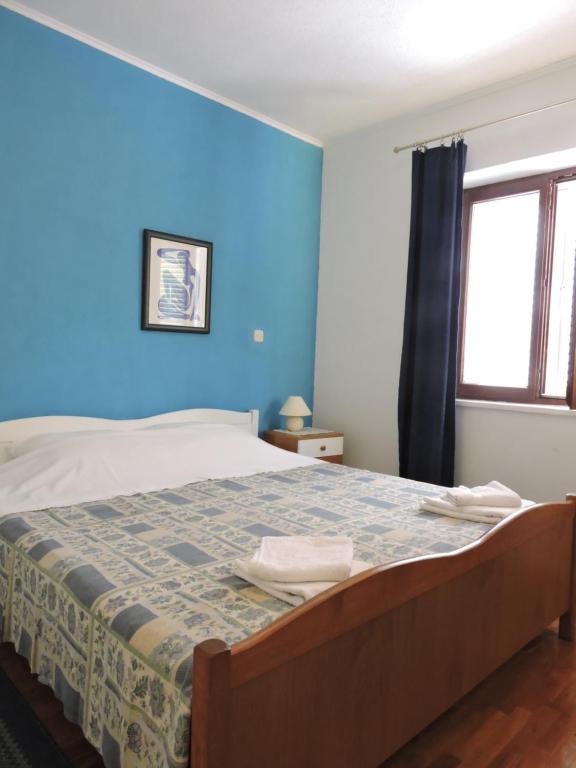 Postel nebo postele na pokoji v ubytování Apartments Ivanov