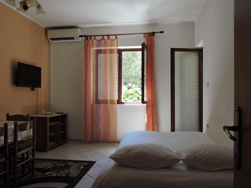 Postel nebo postele na pokoji v ubytování Apartments Ivanov