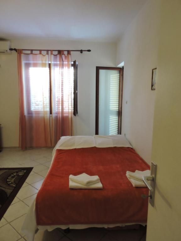 Postel nebo postele na pokoji v ubytování Apartments Ivanov