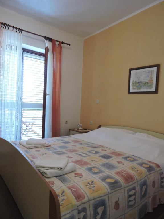 Postel nebo postele na pokoji v ubytování Apartments Ivanov