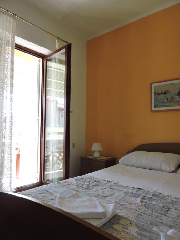 Postel nebo postele na pokoji v ubytování Apartments Ivanov