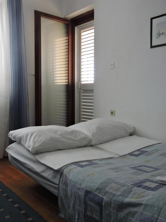 Postel nebo postele na pokoji v ubytování Apartments Ivanov