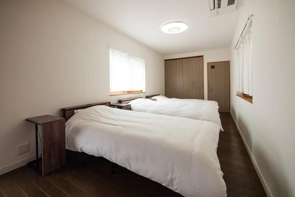 Postel nebo postele na pokoji v ubytování 禅ZEN Retreat Toyama